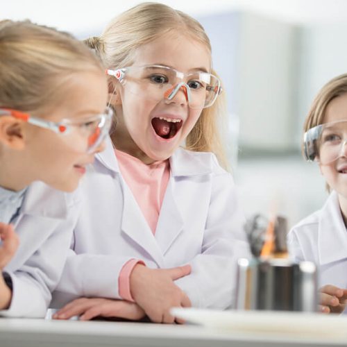 three-kids-wearing-protective-glasses-in-science-l-RTGFW2P.jpg